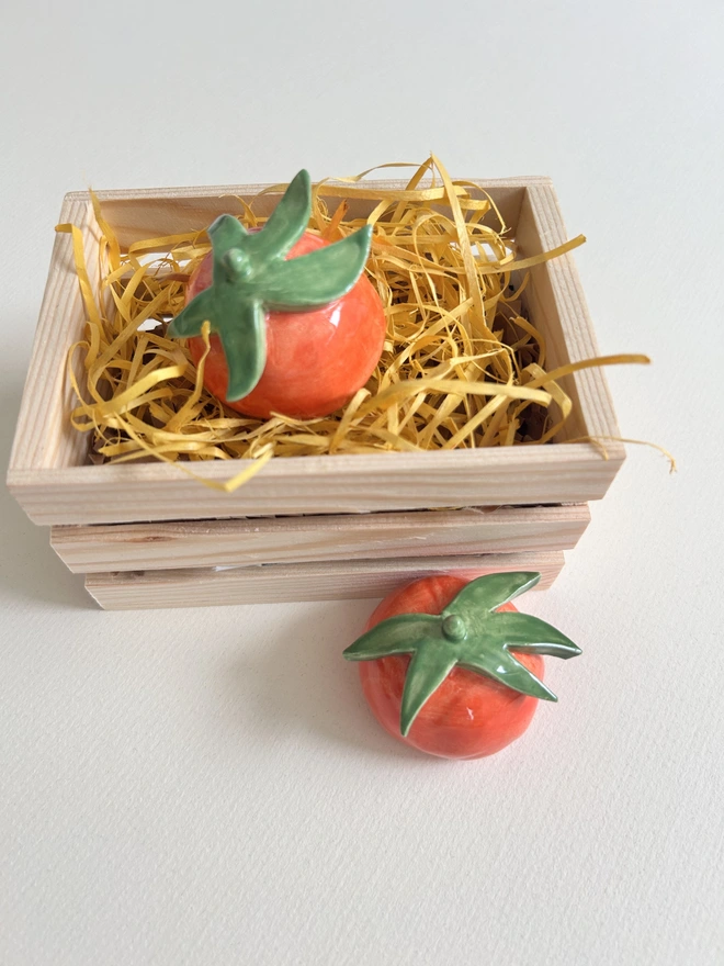 two candle snuffer tomato