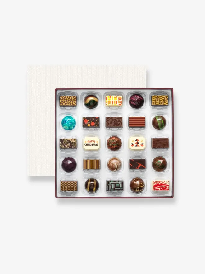 25 luxury chocolates with a 'Happy Christmas' message, presented in a premium box