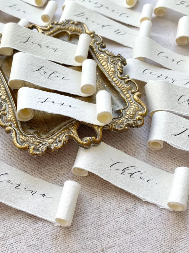 handmade paper scroll place settings with a calligraphy font