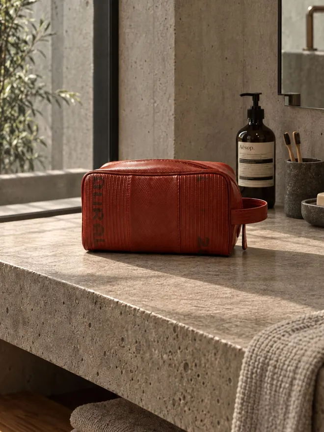 Personalised Fire-Hose Large Wash Bag, a colourful fire hose wash bag sitting on a plain white surface. 
