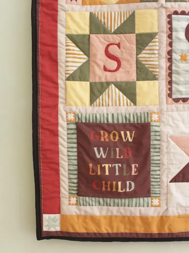 personalised baby quilted wall hanging. a patchwork hanging quilt decoration to commemorate a baby's birth.