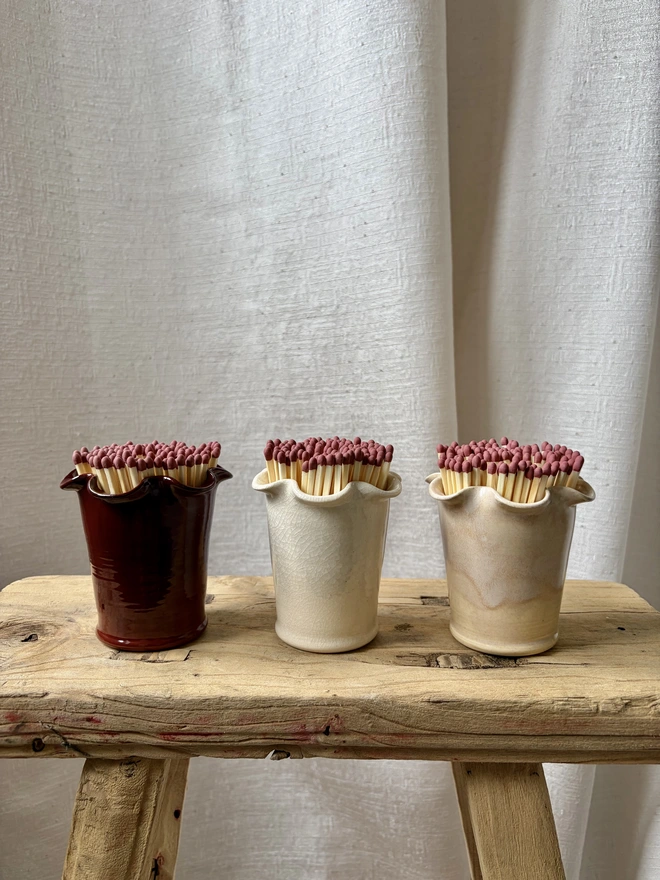 Frilly matchstick pots in cherry red, cream crackle and rose pink with matches
