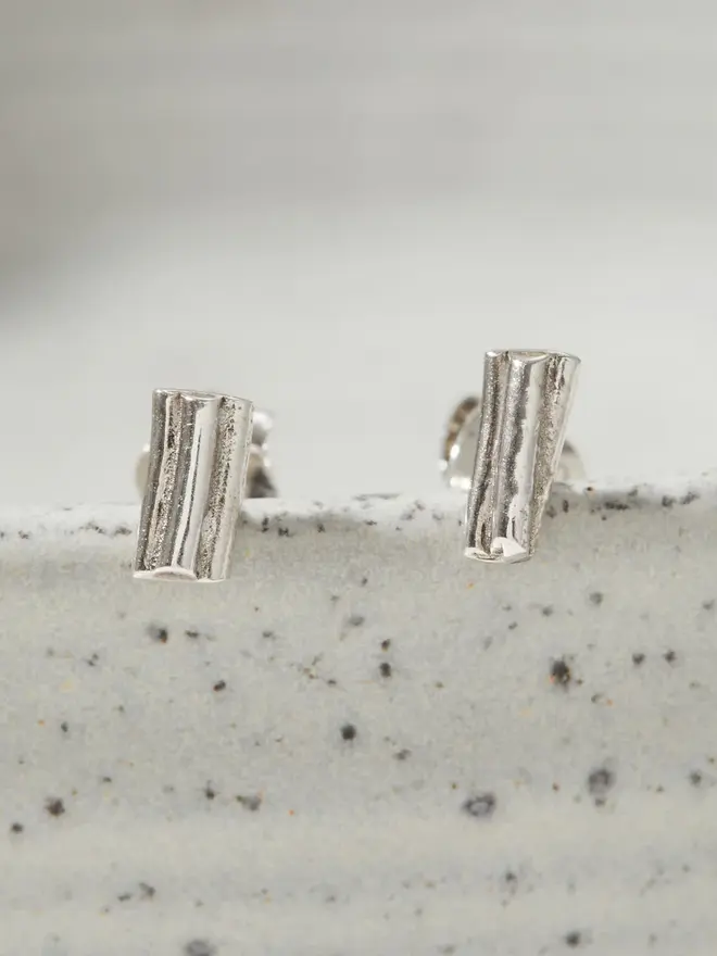 Close up image of two Silver Ripple Stud Earrings