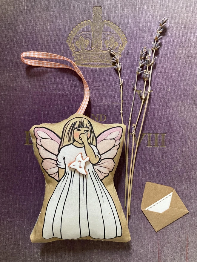 tooth fairy doll with a peace dove button