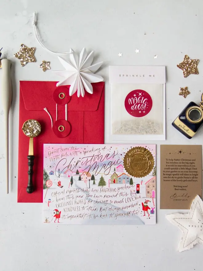 A pink-sky certificate with an illustrated snowy elf village and a gold "Lapland Approved" seal.