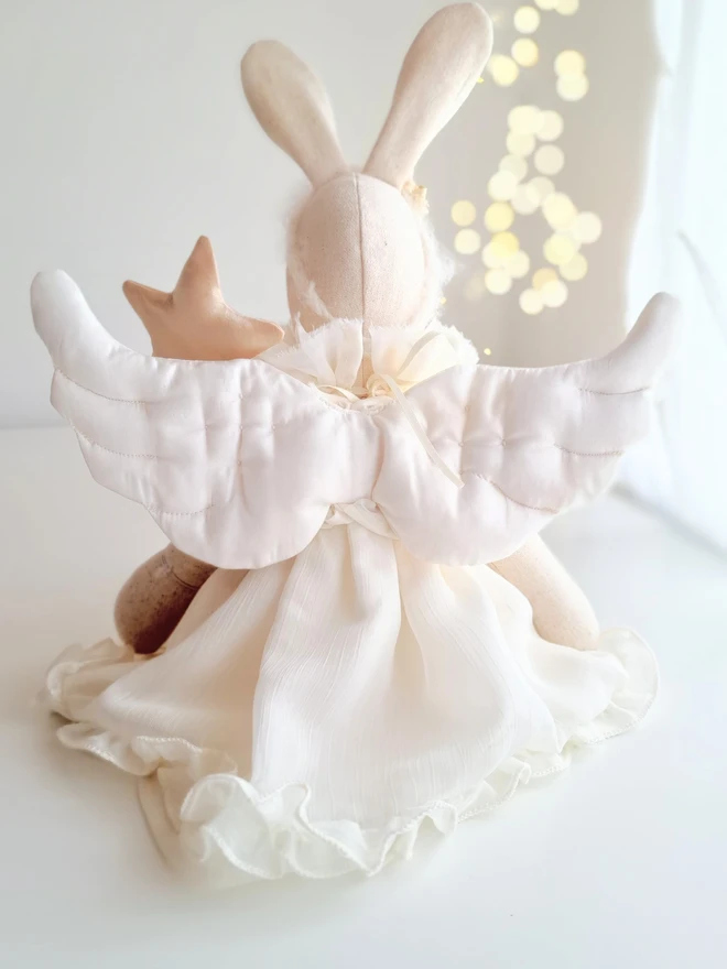 Linen angel bunny doll, rear view of cloth bunny with ruffle ivory dress  and pure silk quilted angel wings.