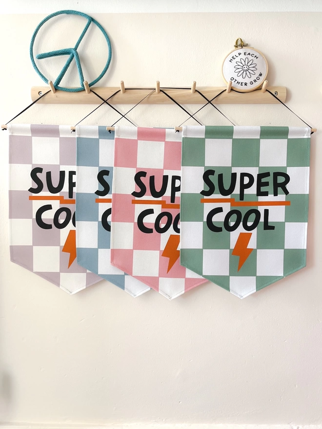 Four super cool wall banners in lilac, blue, pink and green