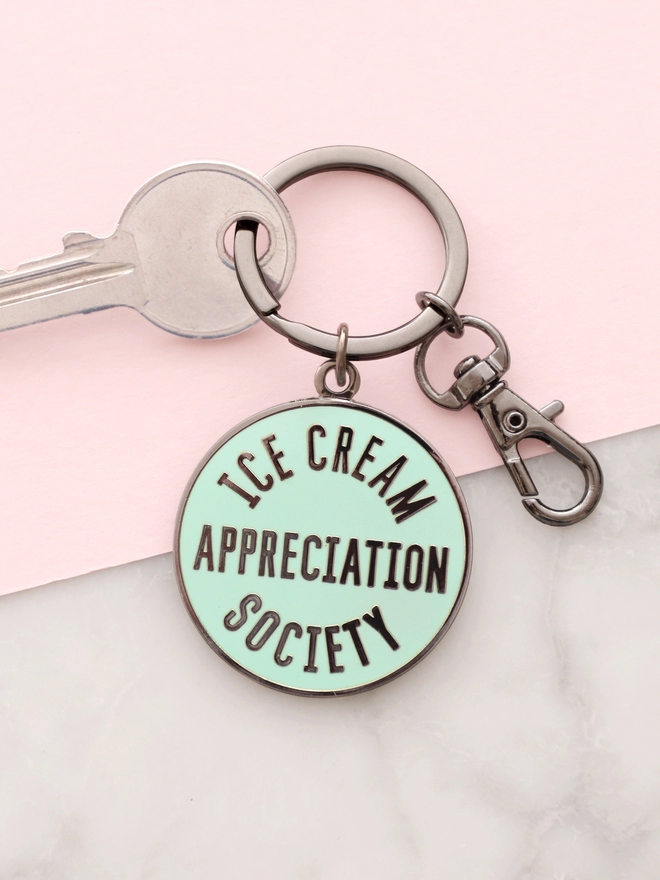Mint green enamel keyring with 'Ice Cream Appreciation Society' design