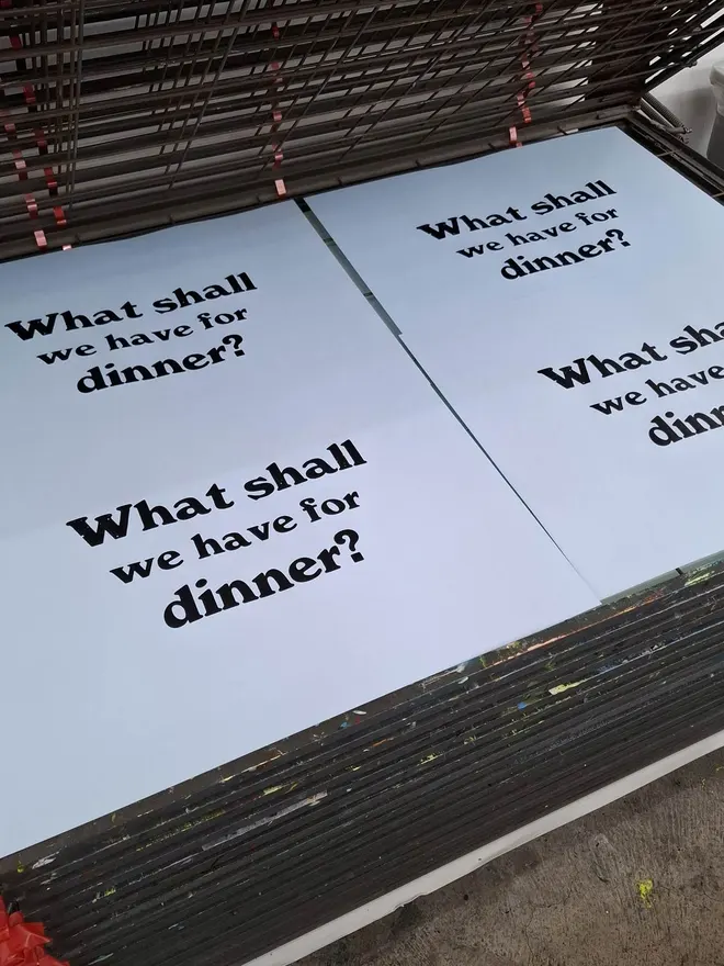 Dinner screen print in blue on drying rack