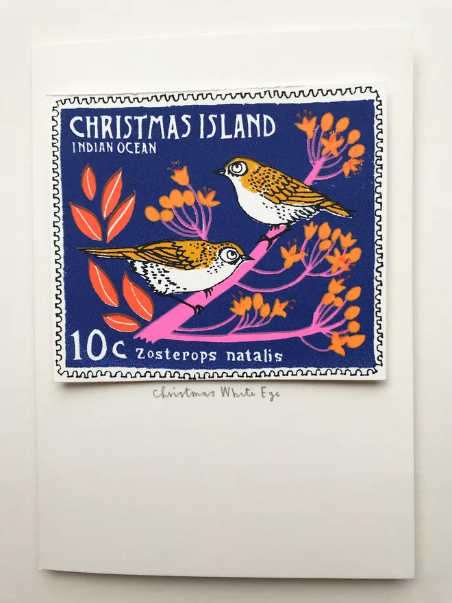 Bird Stamp Card Christmas Island White Eye Stamp, a Christmas card with a pair of birds stamp on a white surface. 