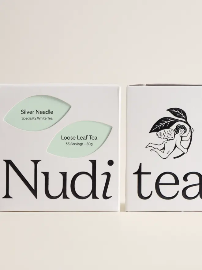 white box of silver needle tea with pale green leaf design