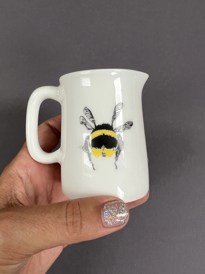 The reverse of the bee jug showing the bees cheeky, fluffy bottom