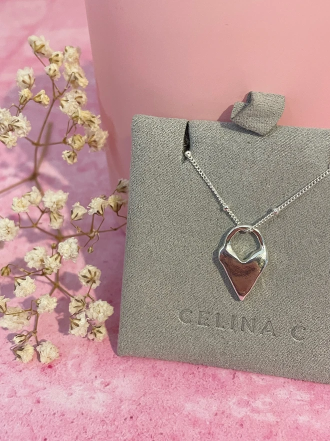 Hand made heart talisman charms made from 100% recycled sterling silver, cute gift for girlfriend or wife for Valentine's Day or Mother's Day. Send straight to your special someone. Made by Celina C Jewellery, a small business in the UK, find on Holly and Co.