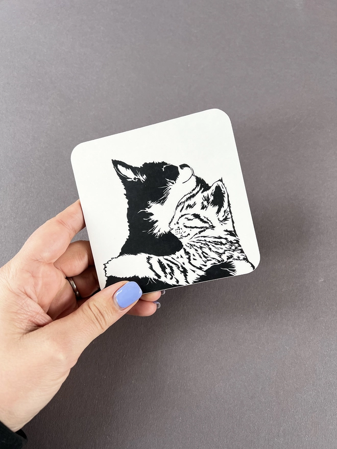 Melamine coaster illustrated with two cuddling cats