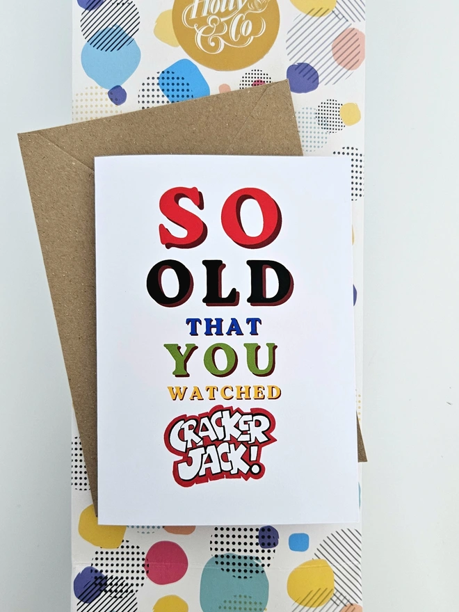 A nostalgic card that says So old that you watched Cracker Jack in colourful retro style fonts on a white background. 