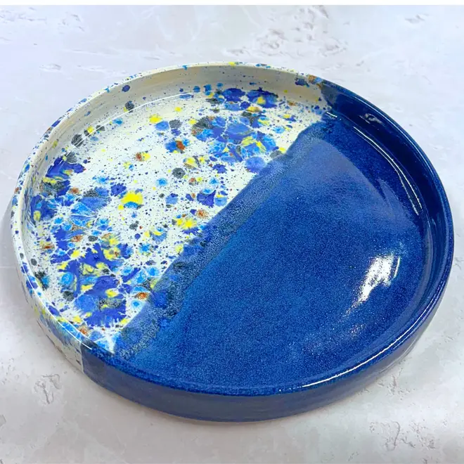 Shoreline Tray, a colourful tray placed on a stone surface. 