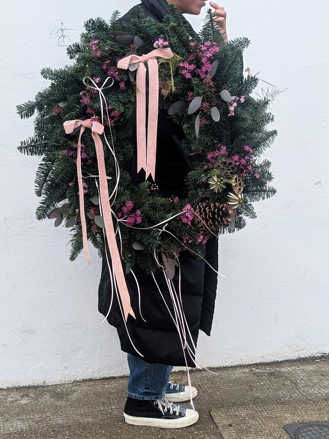 Large 20-inch handmade Christmas wreath on a wire frame, decorated with natural moss and foliage, ready for festive home décor.