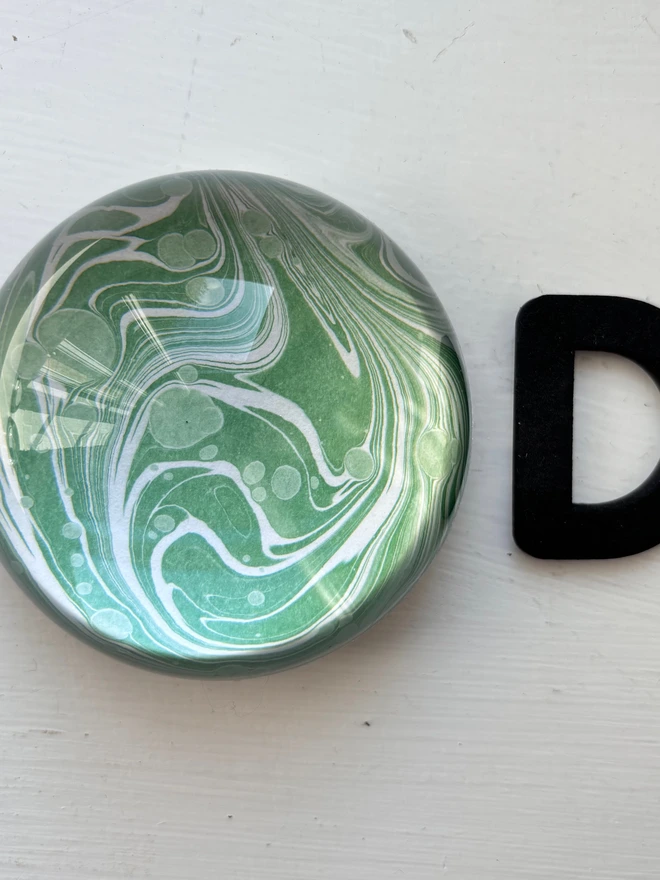 Small Paperweight. A paperweight in D