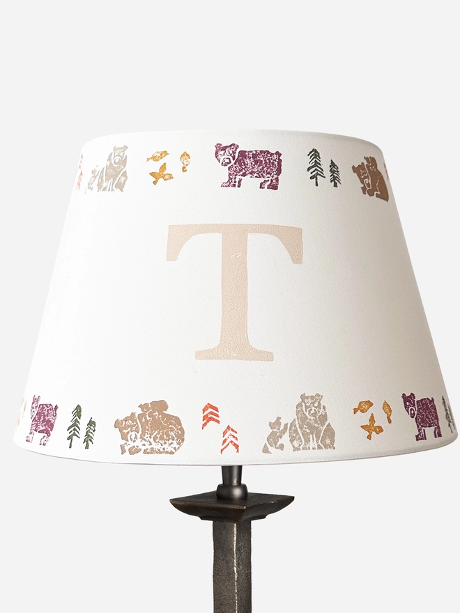 Studio Zef personalised bear lampshade with colourful animal print and large initial 'T'. An empire lampshade designed for kids lighting and thoughtful new parent gifts.