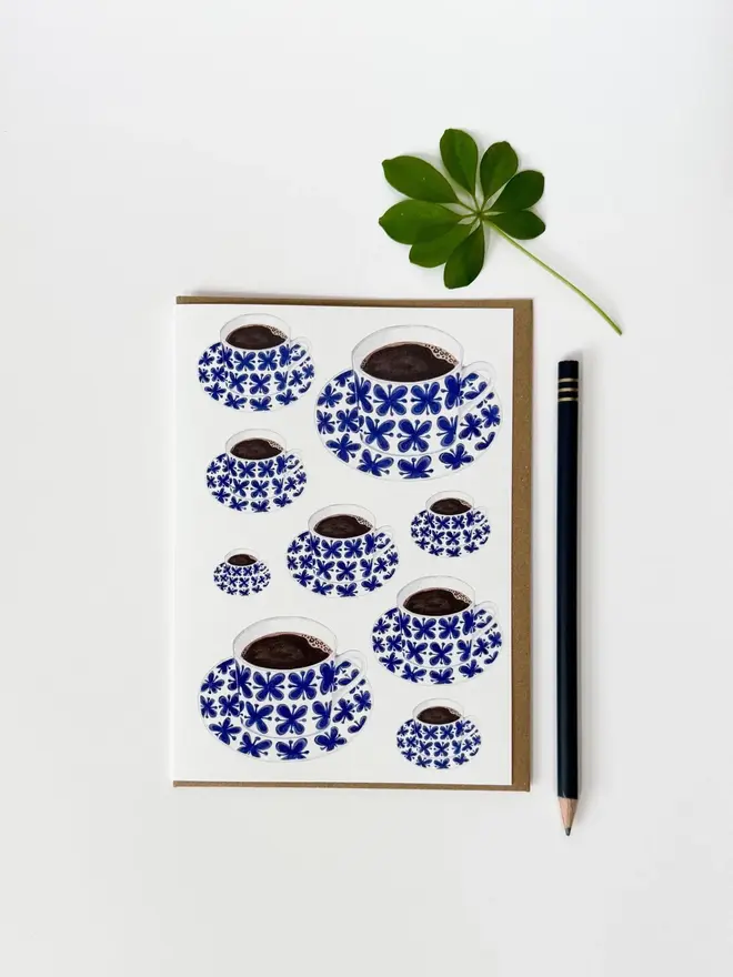 coffee cup and saucer illustrated card. card photographed against white background.