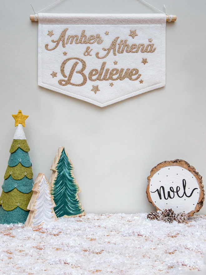 Personalised "Believe" christmas banner, champagne glitter on white felt