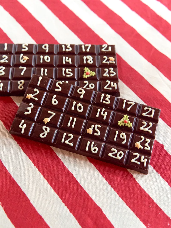 A solid bar of chocolate hand piped with December dates from the 1st to the 24th. 