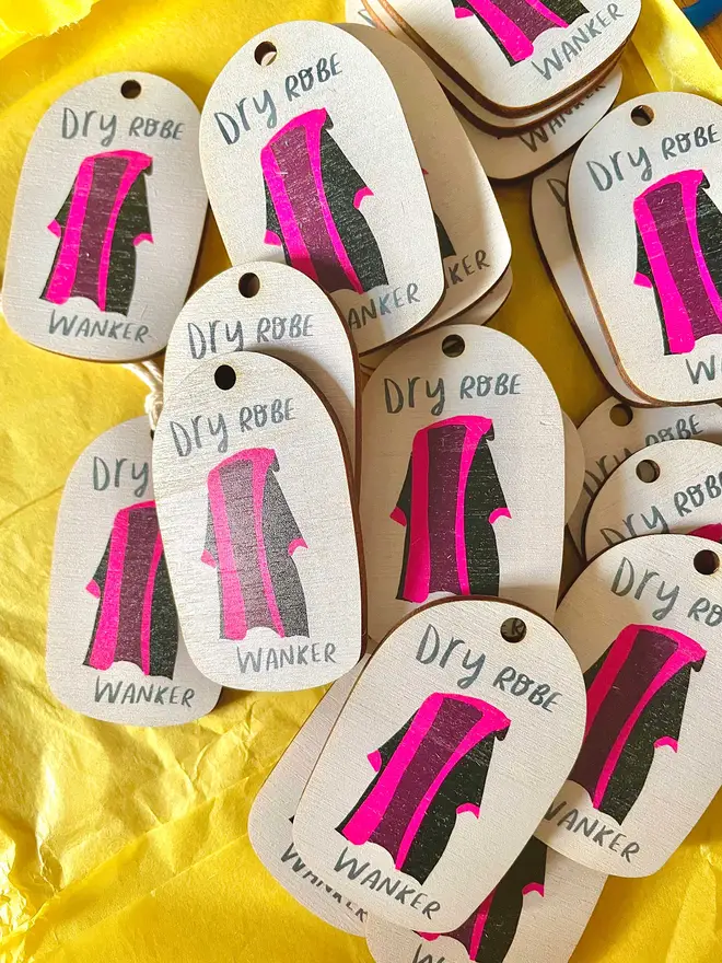 Wooden ornament reads 'dry robe wanker'