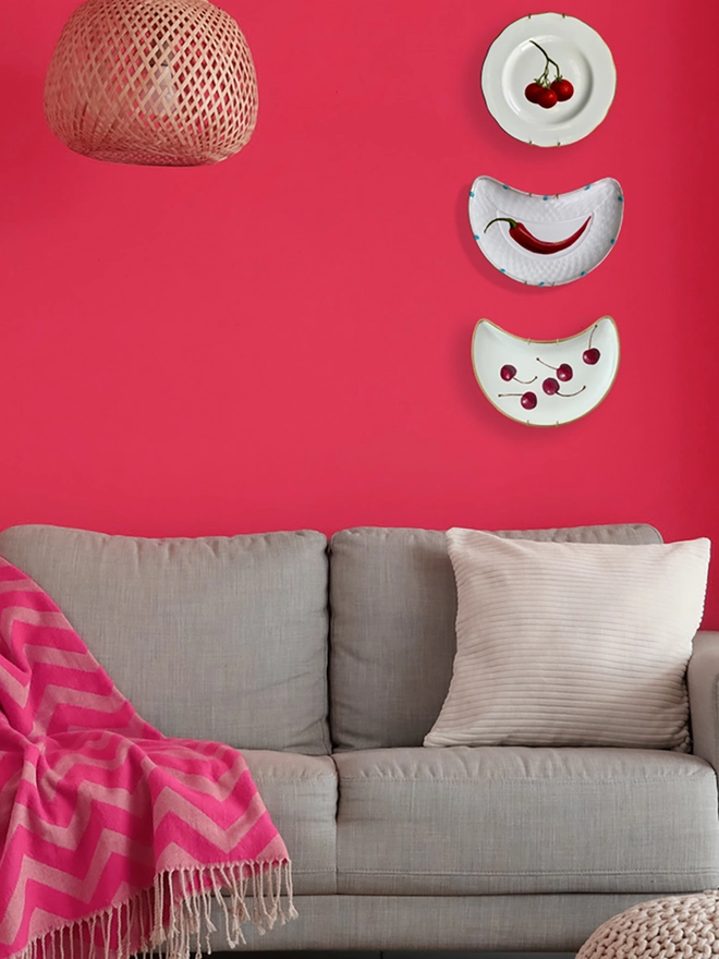 pink room with painted plates