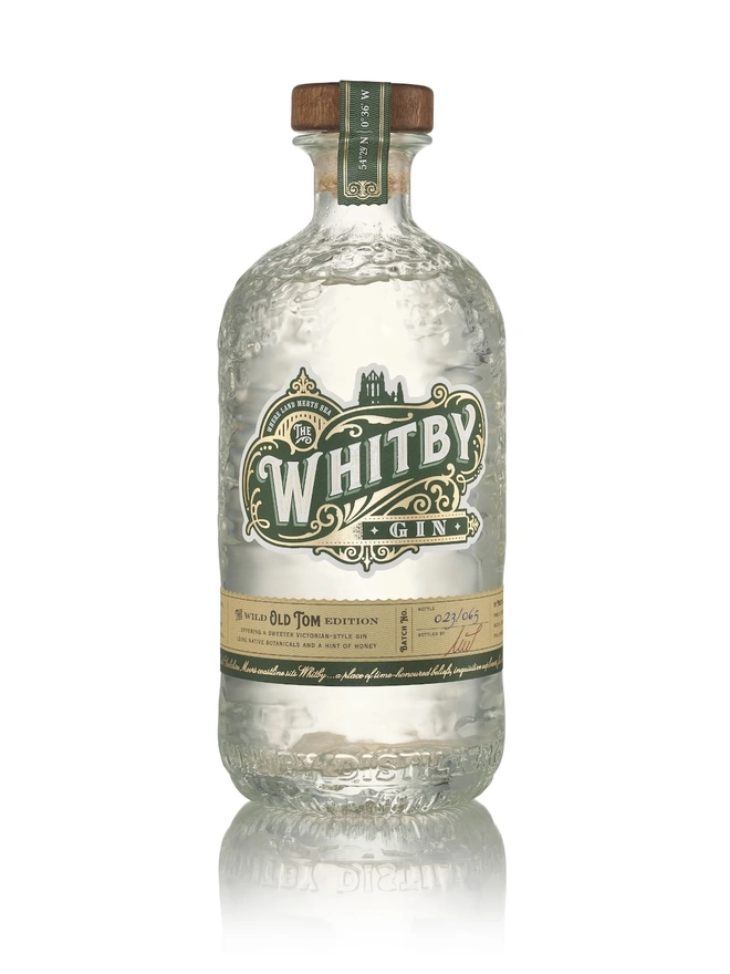Wild Old Tom Edition Gin, a bottle of gin sitting on a plain white surface. 
