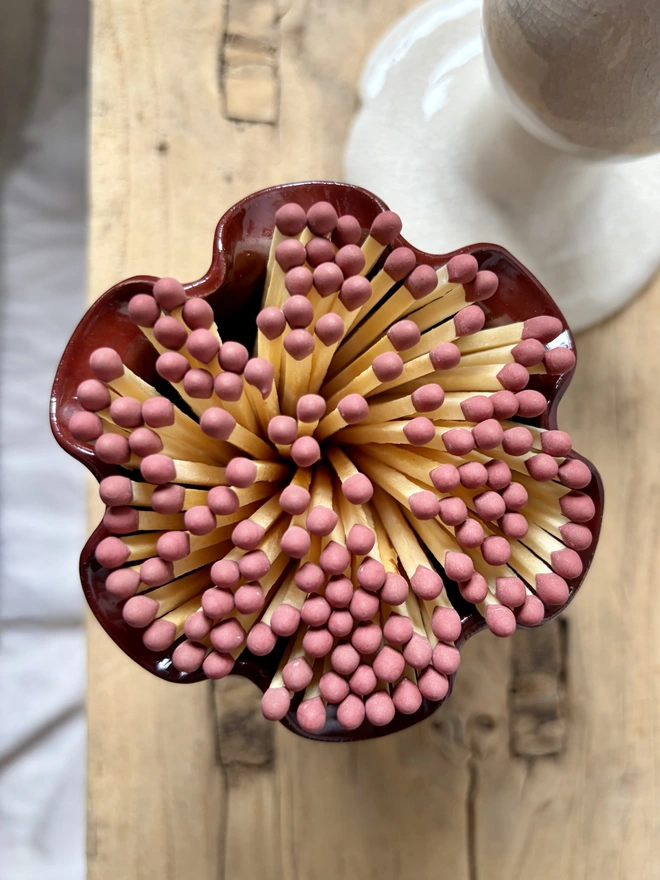Cherry red frilly matchstick pot with matches
