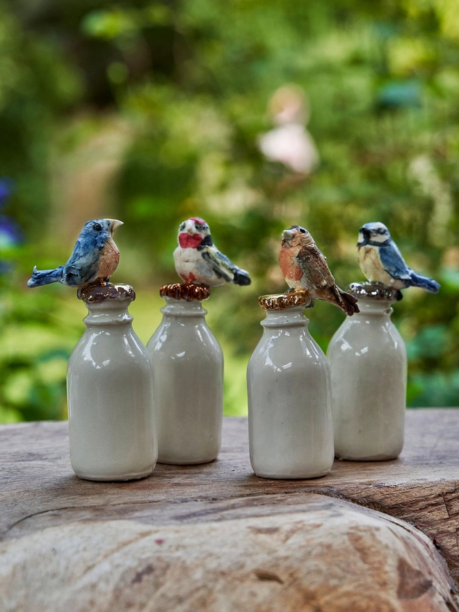 Mini milk bottle bird sculptures