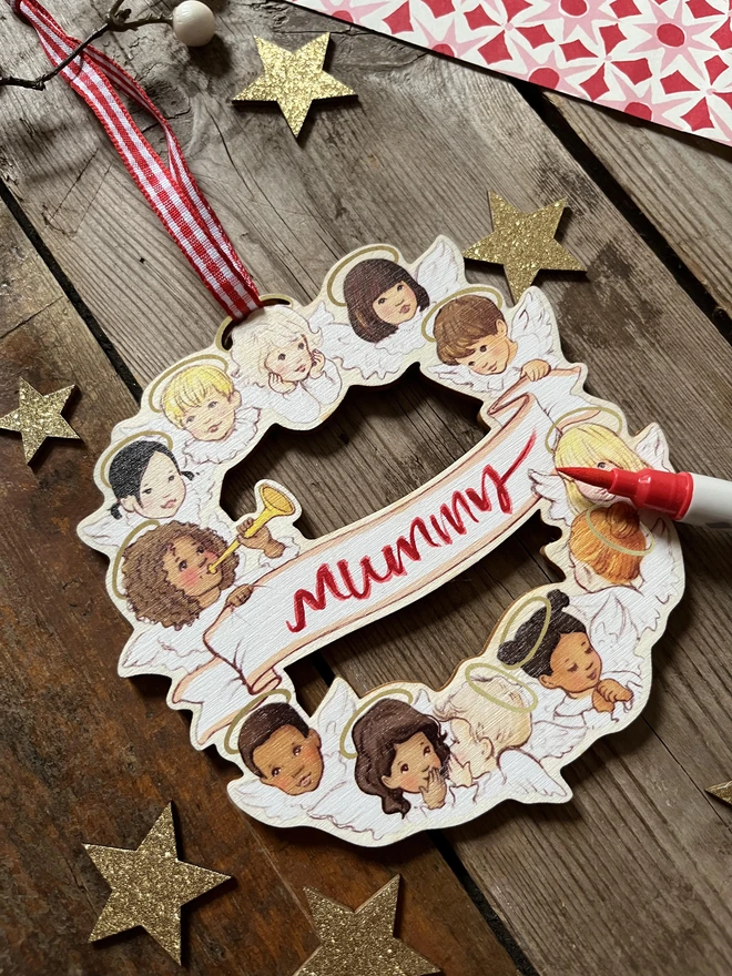 a wooden laser cut traditional personalised Christmas decorative wreath