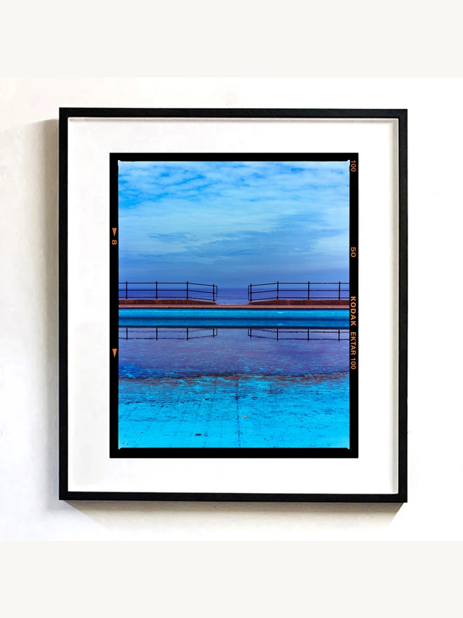 Craig y Don Pool framed in black