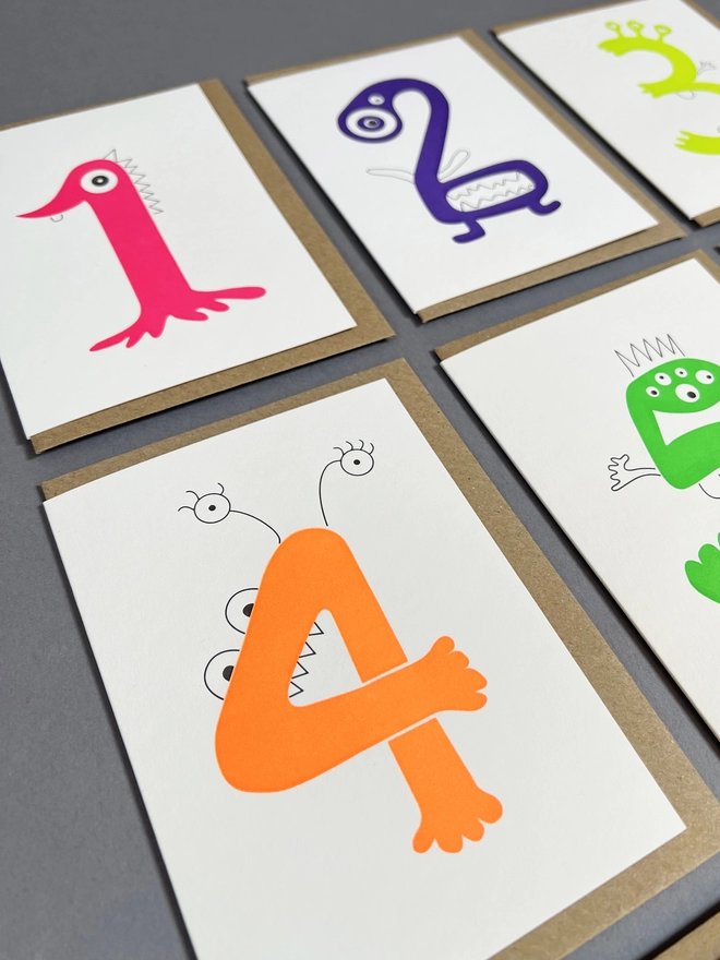Playfully hand drawn letterpress printed neon number four with envelope for children's party