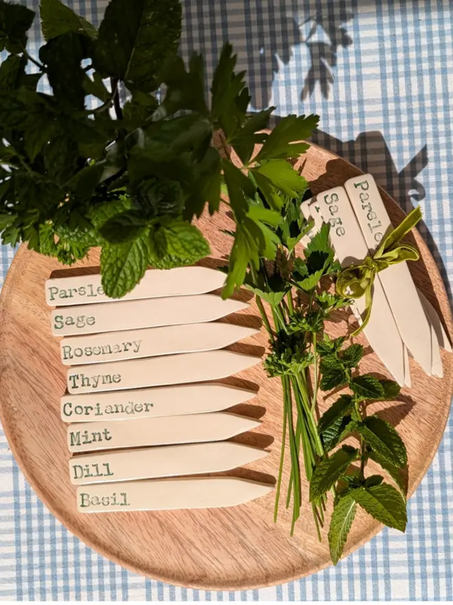 Herb labels pictured with fresh herbs
