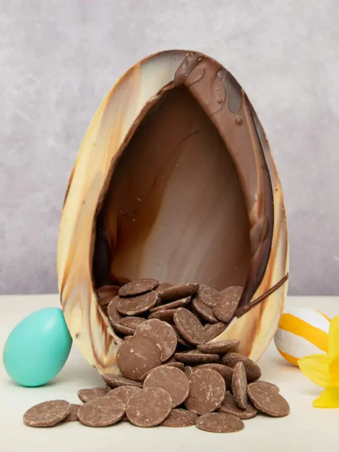 Chocolate marbled easter egg with buttons coming out of it