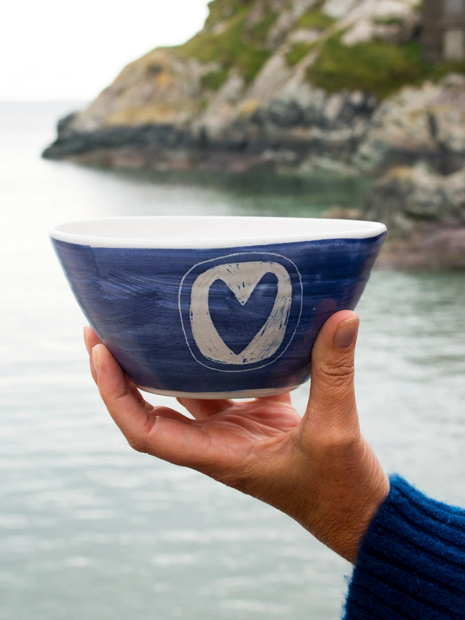 stoneware pottery bowl being held 