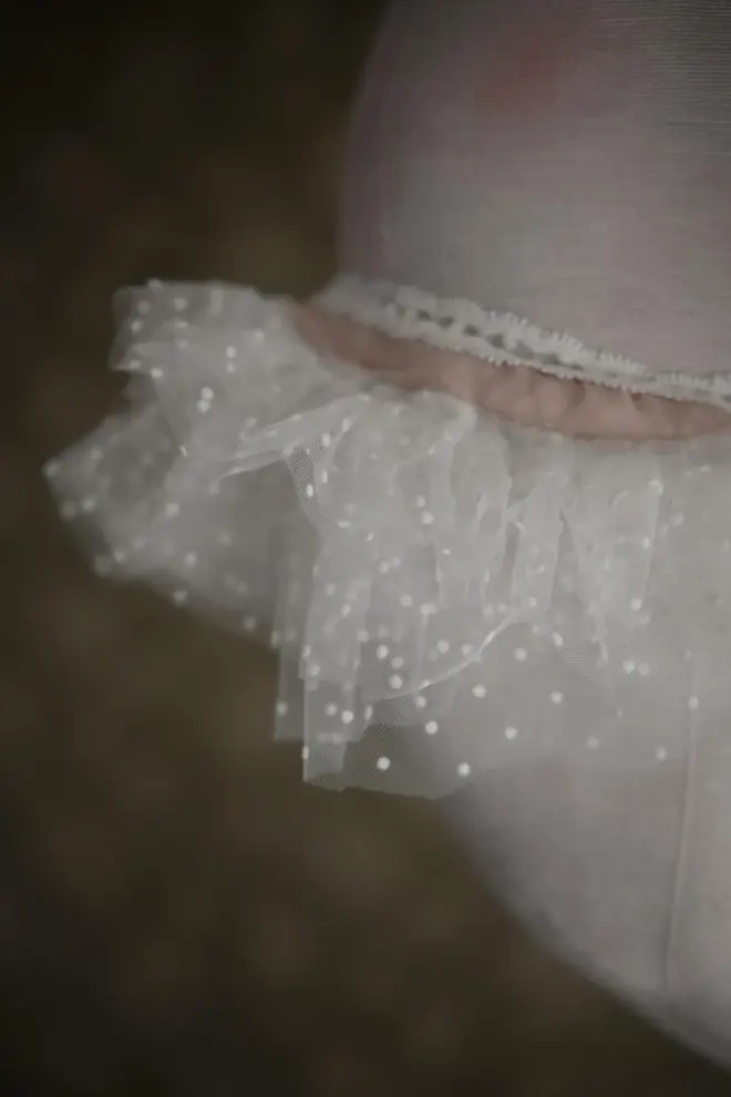 Sleepy Moon Nursery Pillow Hanging Decoration, a hanging pillow decoration suspended in a bedroom. 