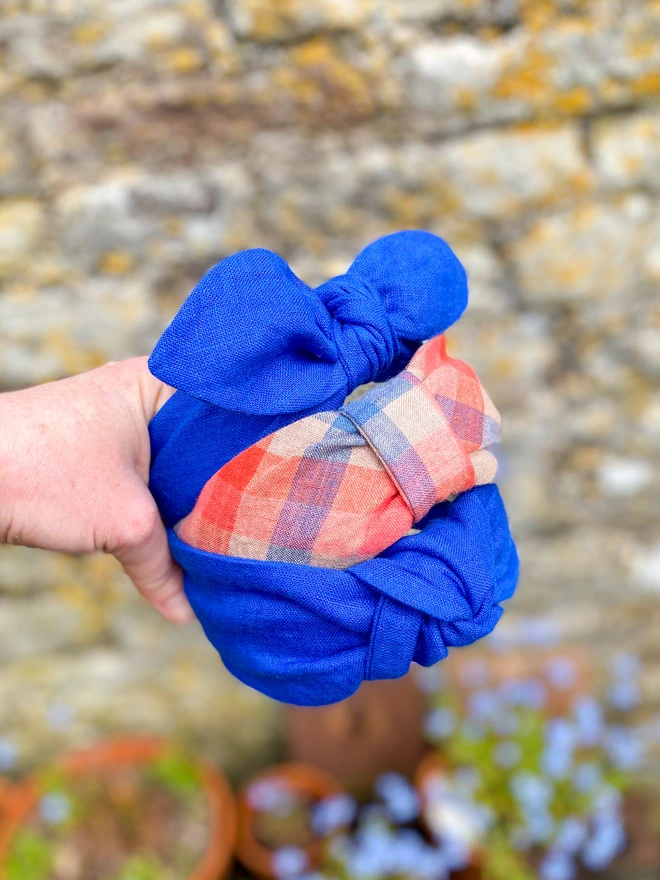 A beautiful handful of linen hairbands in cobalt blue and red check