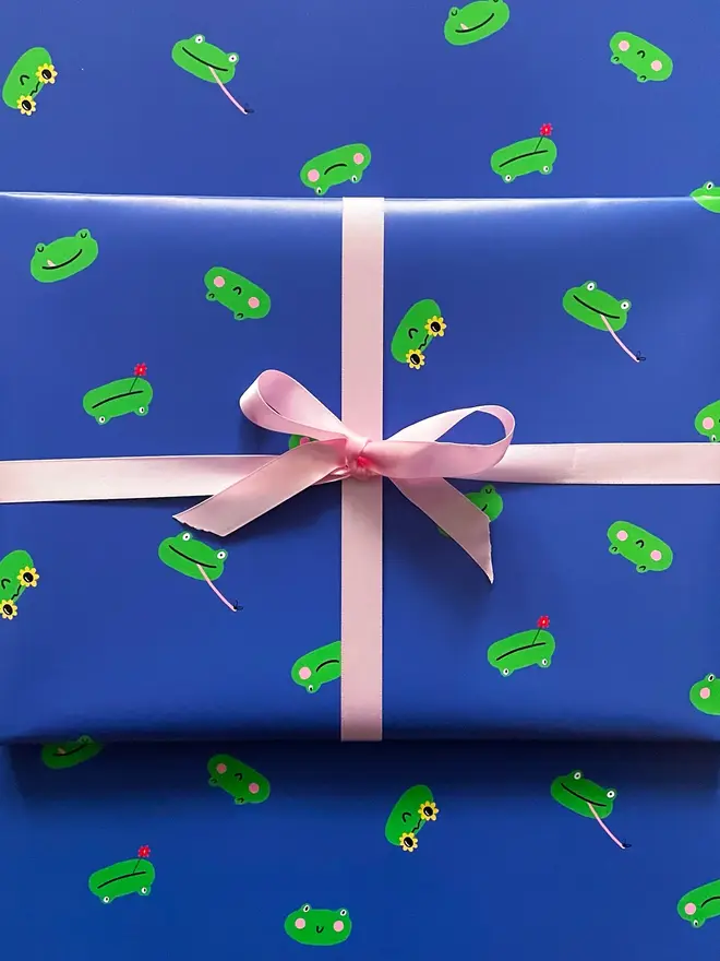 blue and green frog illustrated wrapping paper