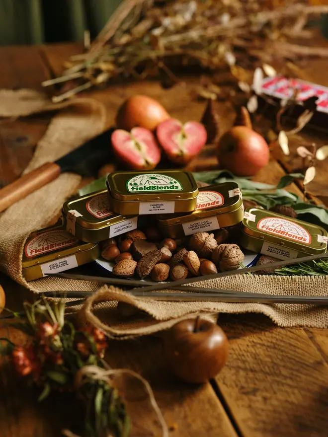 Big Ole Festive Bundle (Pack Of 7), grouped together on a Christmas table, with Christmas food