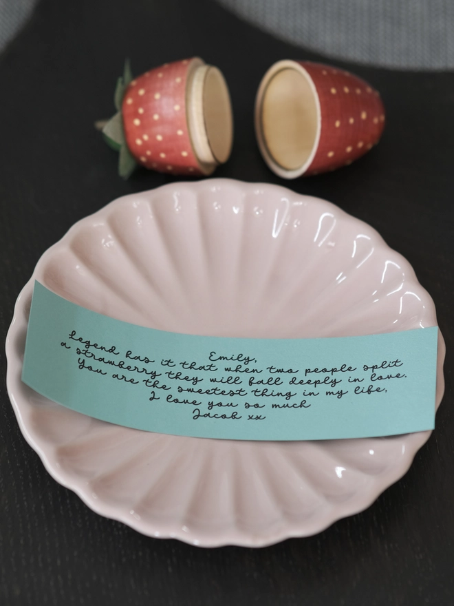 message inside a wooden strawberry