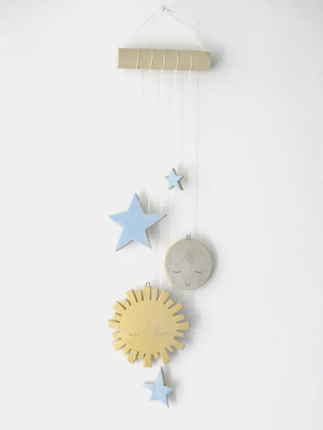 ceramic yellow sun, moon and blue stars hanging decoration
