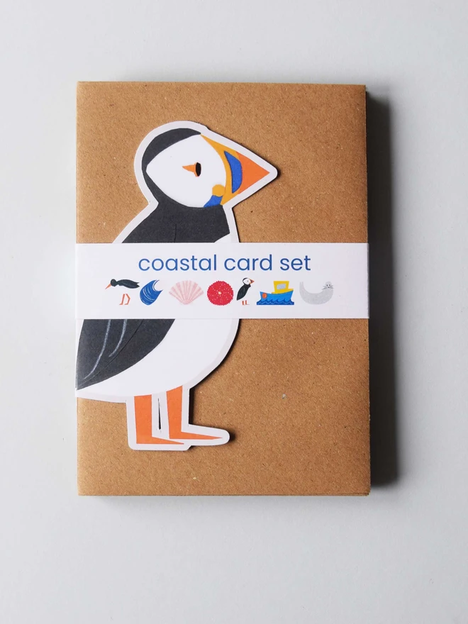 Puffin placed on an envelope with a label on the front for a coastal card set. 