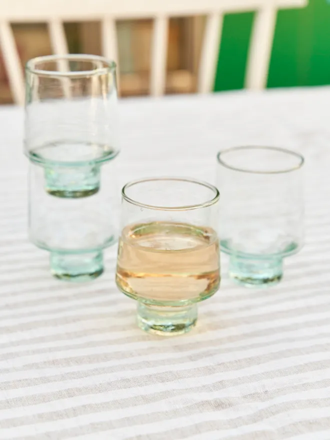 Tall Wine Glasses (Set Of 1 Or 4), a group of tall wine glasses sitting on a stripped tablecloth in the garden 