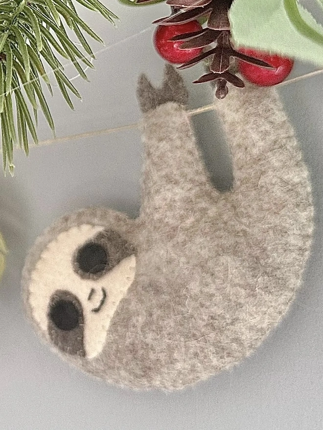 Nursery Safari Garland, a safari themed garland hanging in a child's bedroom against a grey backdrop. 