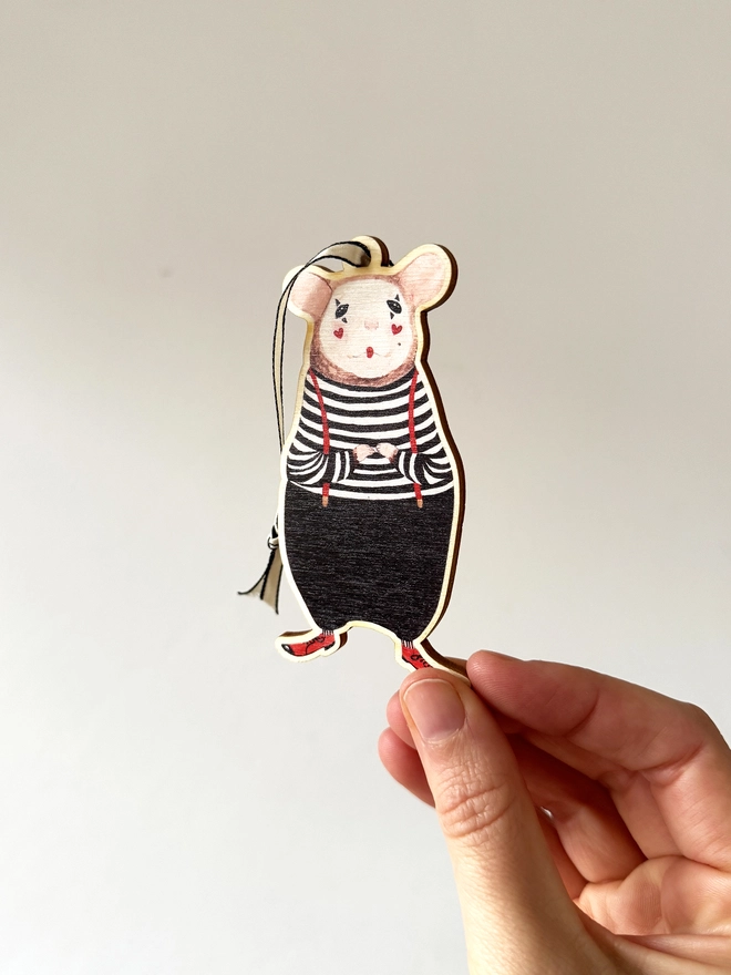 Mouse Christmas decoration in hand