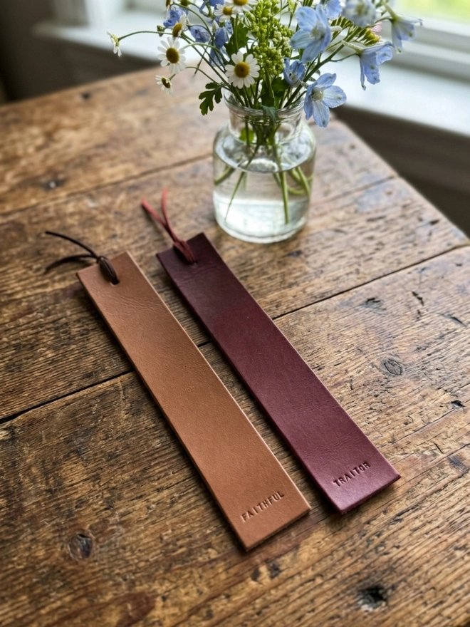 hand stamped leather bookmarks, traitors themed.
