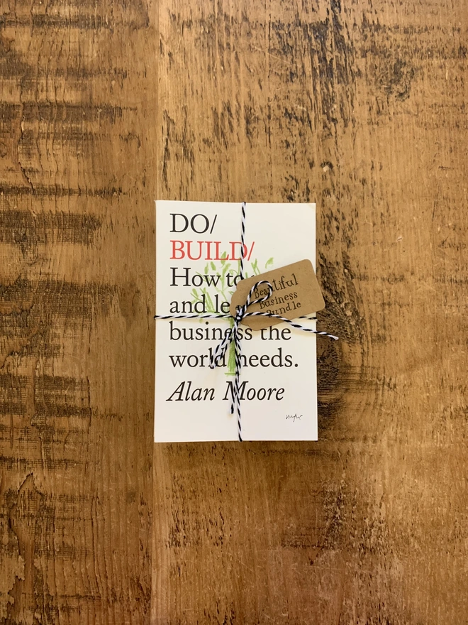 Books tied up with twine on wooden tabletop