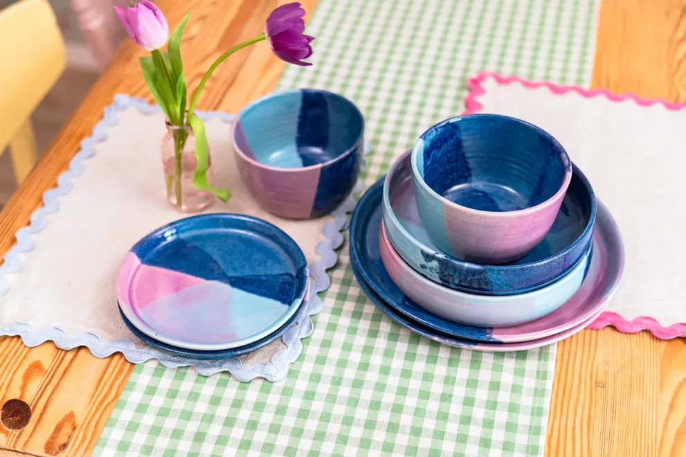 Landscape Dinner Plates (Set Of 4), a colourful table setting made by plate, napkins and other dining items. 